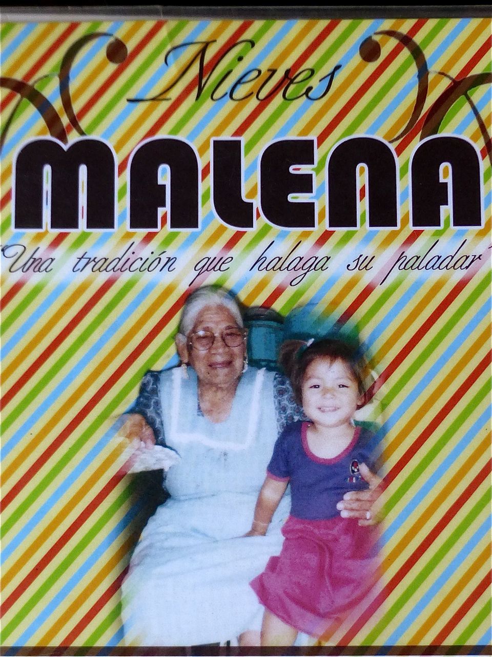 Placard with an image of Señora Malena and a granddaughter